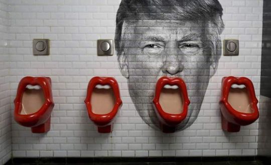 Someone added donald trump to the wall of this restroom in paris 700 0