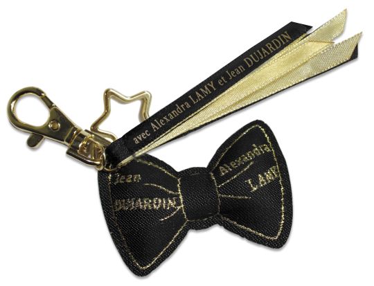 Le noeud papillon noir et doré signé Jean Dujardin et Alexandra Lamy, proposé dans les parfumeries Beauty Success.